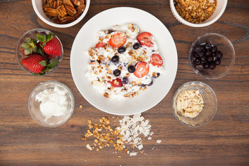 Flat lay of a bowl of yogurt with fruit