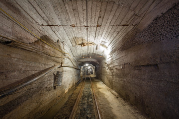 Underground gold mine ore tuneel with rails Berezovsky mine Ural