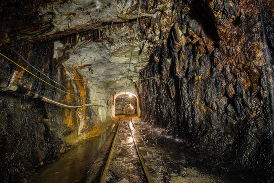 Underground gold mine ore tuneel with rails and stalactites Berezovsky mine Ural