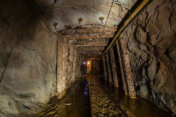 Fototapeta na wymiar Underground gold mine ore tuneel with rails Berezovsky mine Ural