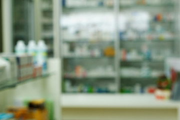 Blurred pharmacy drugstore shelves and counter