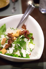 spinach and bread salad on white plate