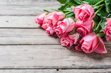 Fresh Flowers on Wooden Background