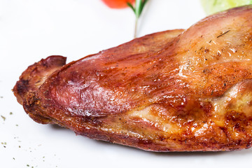 Delicious duck leg confit with posemary bunch. 