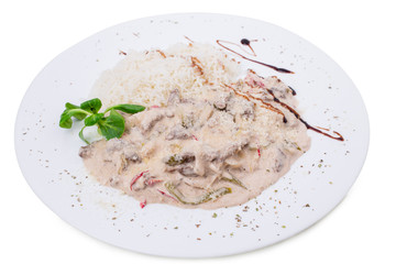 Baked vegetables covered with sauce.