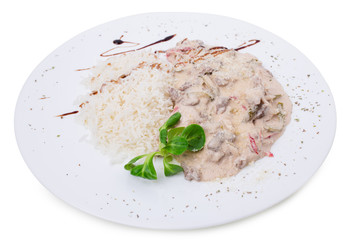 Baked vegetables covered with sauce.