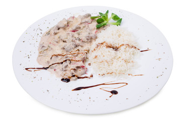 Baked vegetables covered with sauce.