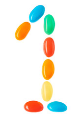 1 number made of multicolored candies isolated on white