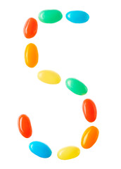 5 number made of multicolored candies isolated on white