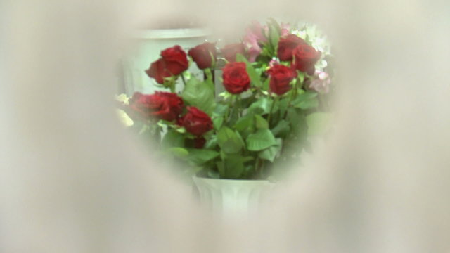 a bouquet of red roses through the heart ,a bouquet of favorite