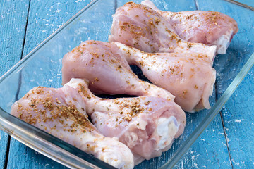 Raw chicken drumstick with spices