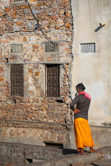 Local man standing by his house in Jaipur, Rajasthan, India