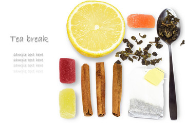 Fototapeta na wymiar Set of tea break : lemon, tea bag, spoon, cinnamon on white background. Space for text.