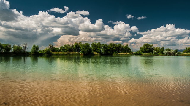4K Timelapse. Сlouds reflected in a lake Sairam-Su, Tian-Shan, Kazahkstan.