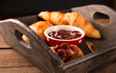 breakfast with croissant and strawberry jam