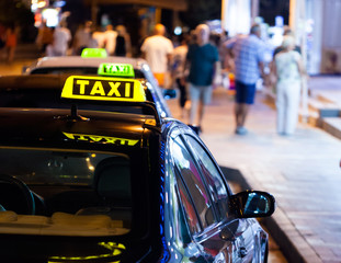 Taxi sign at night