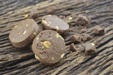 Chocolate cookies on old wooden background