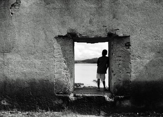 Boy looking view from window the underwater temple