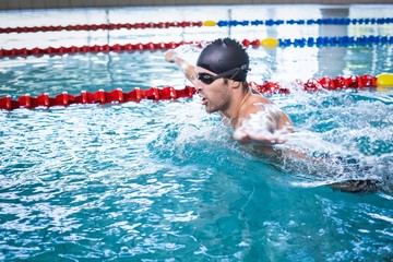 Handsome man swimming