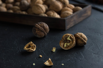 Walnuts whole in their skins, chopped, nut hulls, walnut kernels