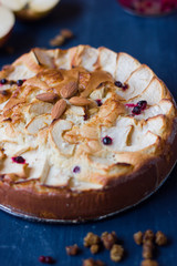 Apple pie on a blue wooden table