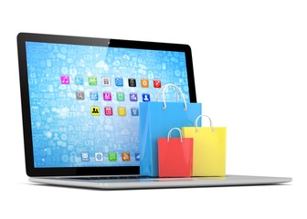 laptop and  shopping pags on white background