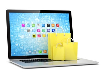 laptop and  shopping pags on white background