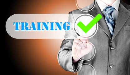 Businessman pressing touch screen interface training checkbox