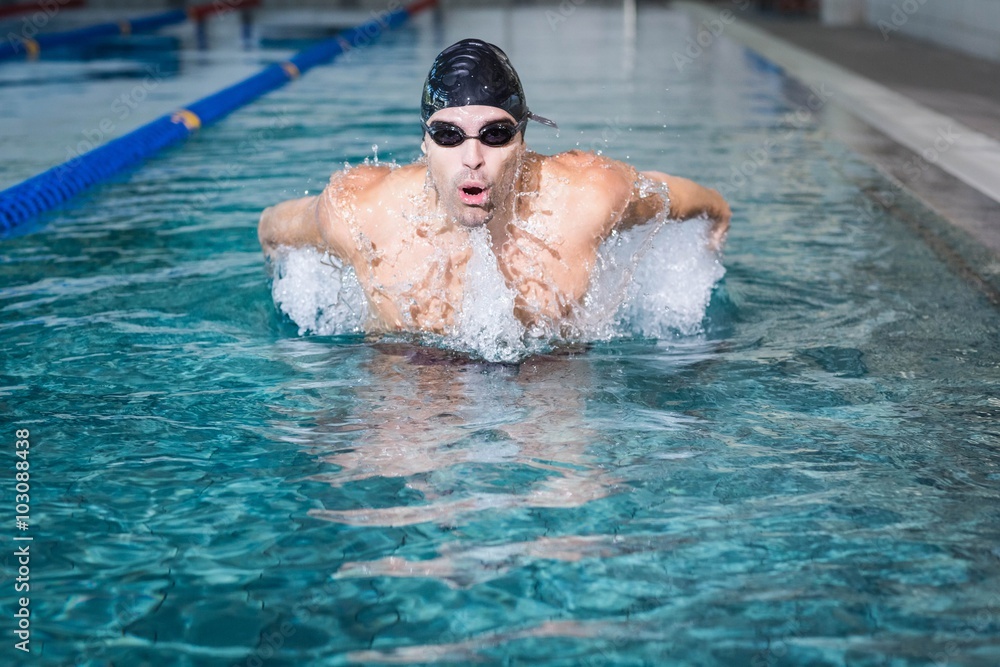 Wall mural fit man swimming