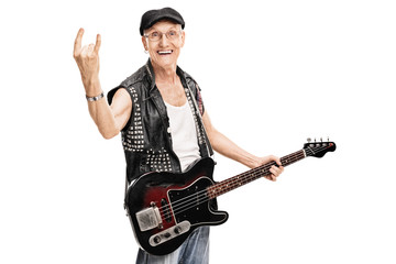 Old punk rocker making a rock gesture