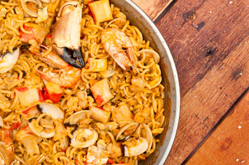 Catalan Fideua, a traditional seafood dish from north east Spain similar to paella but made with short lengths of pasta instead of rice.
