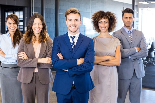 Portrait of confident business team in office - Powered by Adobe