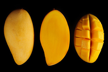 Mango slices on black background