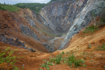 Old abandoned gold mine tunnel passage with yellow sulfur dirt
