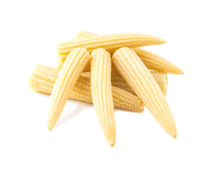 marinated mini corn lying on each other isolated