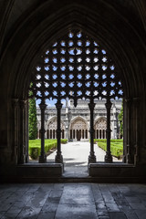 Fototapeta na wymiar Batalha, Portugal - July, 2015: Silhouette of the tracery work on the Royal Cloister of the Batalha Abbey. Masterpiece of the Gothic and Manueline art. UNESCO World Heritage Site.
