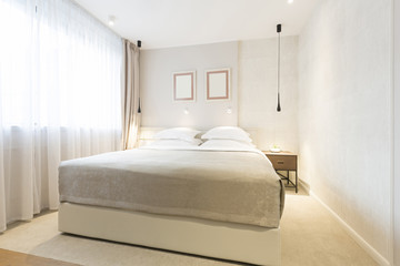 Interior of a double hotel bedroom in the morning