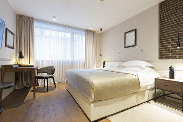 Interior of a double hotel bedroom in the morning