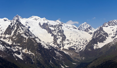 Fototapeta na wymiar White peaks mountains of Dombai.The Caucasus.Russia. 
