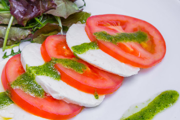 Fresh salad with tomatoes, mozzarella, closeup