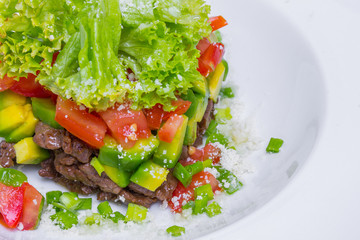 Salad with veal and avocado, closeup