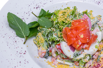 Salmon salad with prawns, closeup