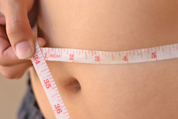 women with tape measure.