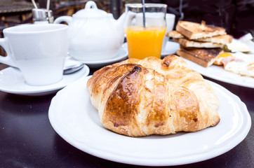 Breakfast with coffee and croissants