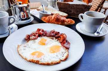 Breakfast with coffee and croissants
