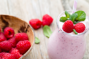 Raspberry milk shake with mint decor.