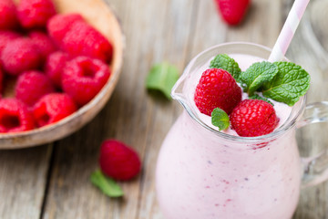 Raspberry milk shake with mint decor.