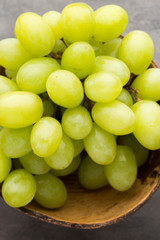 Grape cluster on the grey background.