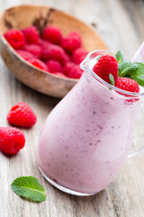 Raspberry milk shake with mint decor.