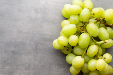 Grape cluster on the grey background.